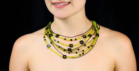 Jewelry on the neck of women . Studio shot with black background.の写真素材