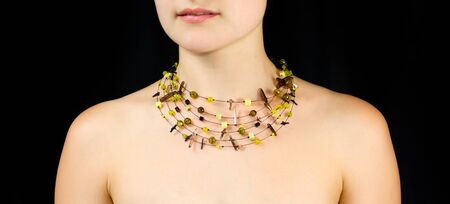 Jewelry on the neck of women . Studio shot with black background.の写真素材