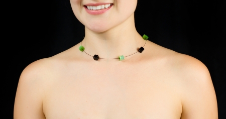 Jewelry on the neck of women . Studio shot with black background.の写真素材