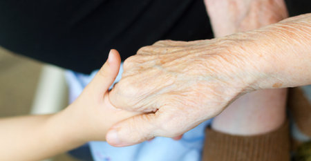 Grandmother holds the hand of his grandson