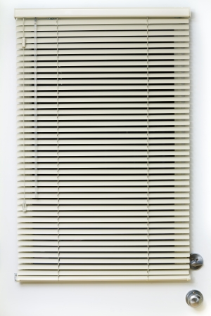 Metal blinds with drawstring on the doorの写真素材