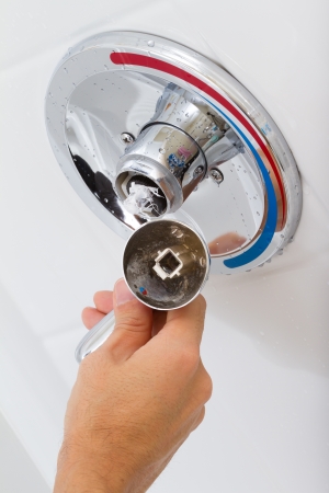 Broken Shower faucet cold and hot water in the bathroomの写真素材