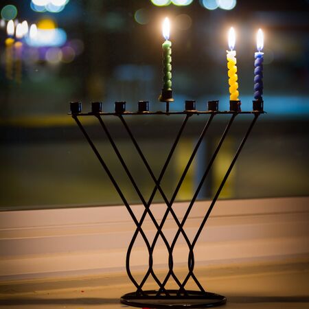 Beautiful candles and hanukkah menorah with defocus backgroundの写真素材