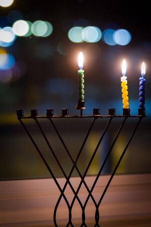 Beautiful candles and hanukkah menorah with defocus backgroundの写真素材