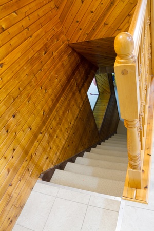 Beautiful foyer looking down hardwood stairs in new houseの写真素材