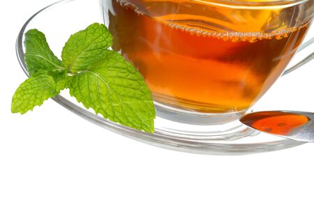 Tea cup with mint leaves on a white backgroundの写真素材