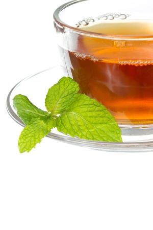 Tea cup with mint leaves on a white backgroundの写真素材