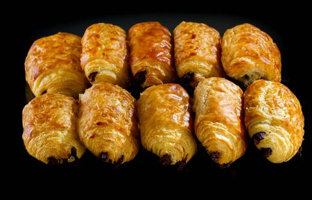 Tasty and fresh croissant on black backgroundの写真素材