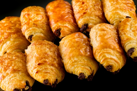 Tasty and fresh croissant on black backgroundの写真素材