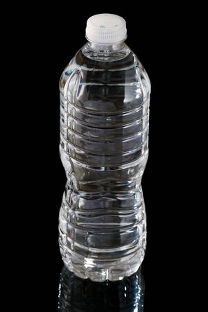 Bottle of water isolated on a black backgroundの写真素材