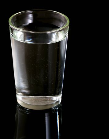 Glass of water on black backgroundの写真素材