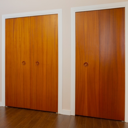 Wooden doors of the closets in the bedroomの写真素材