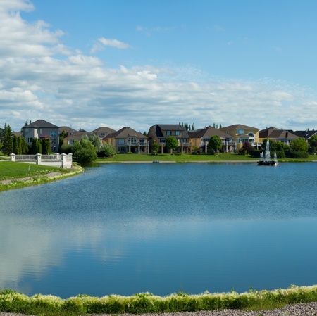 Beautiful pond with estate homes in the background in Winnipeg  Canadaの写真素材