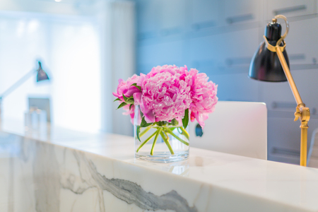 Reception Interior with beautiful pink flowers in vaseの写真素材