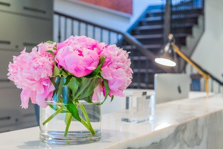 Reception Interior with beautiful pink flowers in vaseの写真素材
