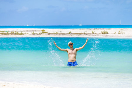 Young man on the caribbean beach in Cayo Largo. Cuba