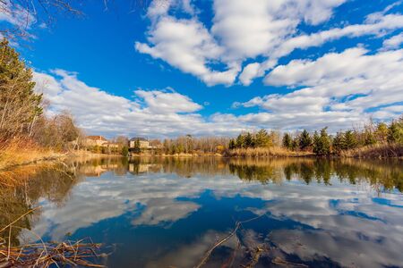 Rural landscape with pond in autumn in Canadaの写真素材