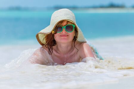 Young woman on the caribbean beach in Cubaの写真素材