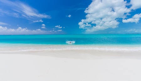 Tropical beach background with white sand beach and soft blur seaの写真素材