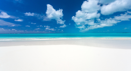 Tropical beach background with white sand beach and soft blur seaの写真素材