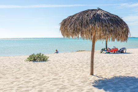 Beach Umbrella made of palm leafs on the background of an exotic beach in Cayo Largoの写真素材