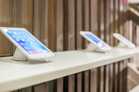 Stand with tablet computers and free wifi for customersの写真素材