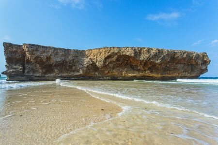 Big  rock on the beach of Arubaの写真素材