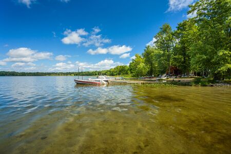 Beautiful lake and the sky with white cloudsの写真素材