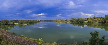 Panorama of lake with cloudsの写真素材