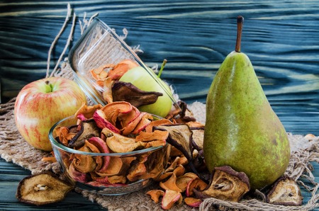 still life of fruit and dried fruits on wooden backgroundの写真素材