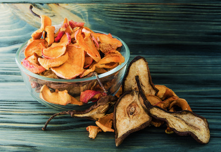 still life of fruit and dried fruits on wooden backgroundの写真素材