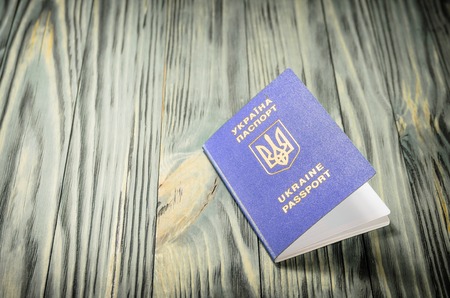 Ukrainian passport closeup on wooden background close-upの写真素材
