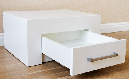 New furniture, bedside table with drawer, close-upの写真素材