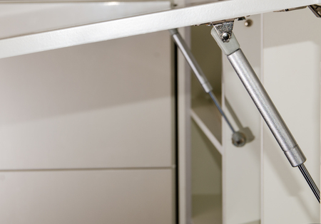 furniture rack, gas lift for the furniture fronts of kitchen units closeupの写真素材