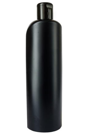 black bottle of shampoo close up on a white backgroundの写真素材