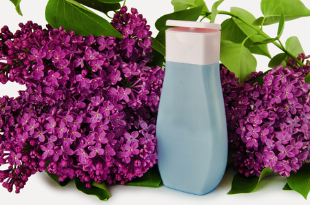 Plastic shampoo bottle on a lilac backgroundの写真素材