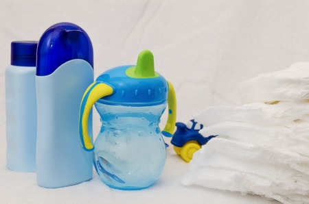 accessories for baby diapers on white background, banny, a bottle of water, creamの写真素材