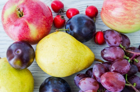 Organic Fruits over wood background. Autumn harvestの写真素材