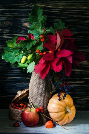 Fall Still Life with Pumpkins, cornucopia and fresh fruits. Vertical Composition.の写真素材