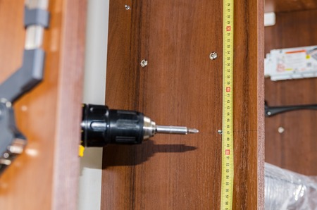 installation of furniture and layout of holes for shelvesの写真素材