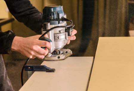 Employee workpieces for furniture hand router closeup