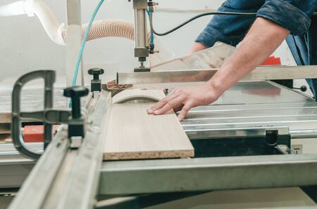 Production of cabinet furniture, sawing, materials on a format-cutting machineの写真素材