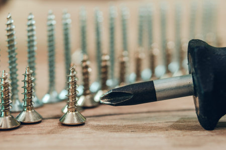 number of screws on the wooden background