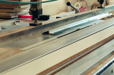 Production of cabinet furniture, sawing, materials on a format-cutting machineの写真素材