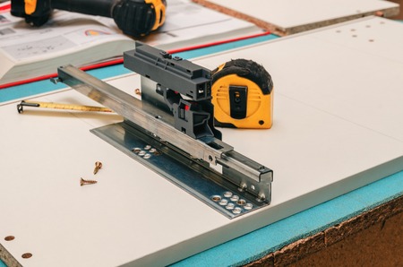 Assembly of furniture, marking and installation of guides for the drawer.の写真素材
