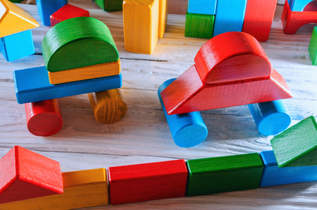 Childrens wooden designer from blocks of a different formの写真素材