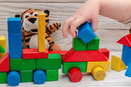 Childrens wooden designer from blocks of a different formの写真素材