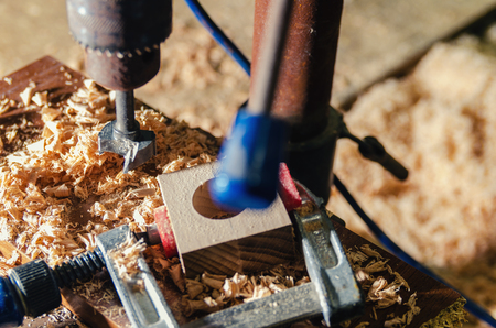 The master makes a hole in the wooden blank.の写真素材