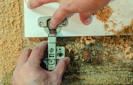 Installation of a furniture canopy on a furniture facade, close-upの写真素材