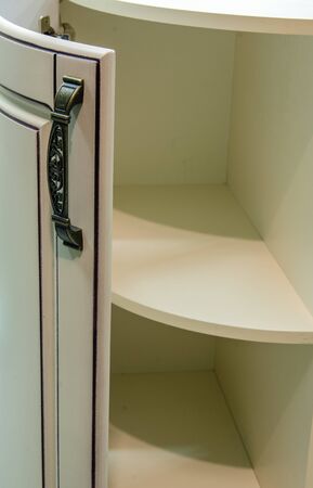 Door handles in retro style for furniture production, blackened bronze on a wooden background, close-upの写真素材